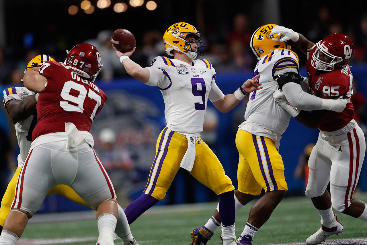 LSU quarterback Joe Burrow (9) throws a pass during the first half of the Peach Bowl against Oklahoma on Saturday in Atlanta. (AP Photo/John Bazemore)