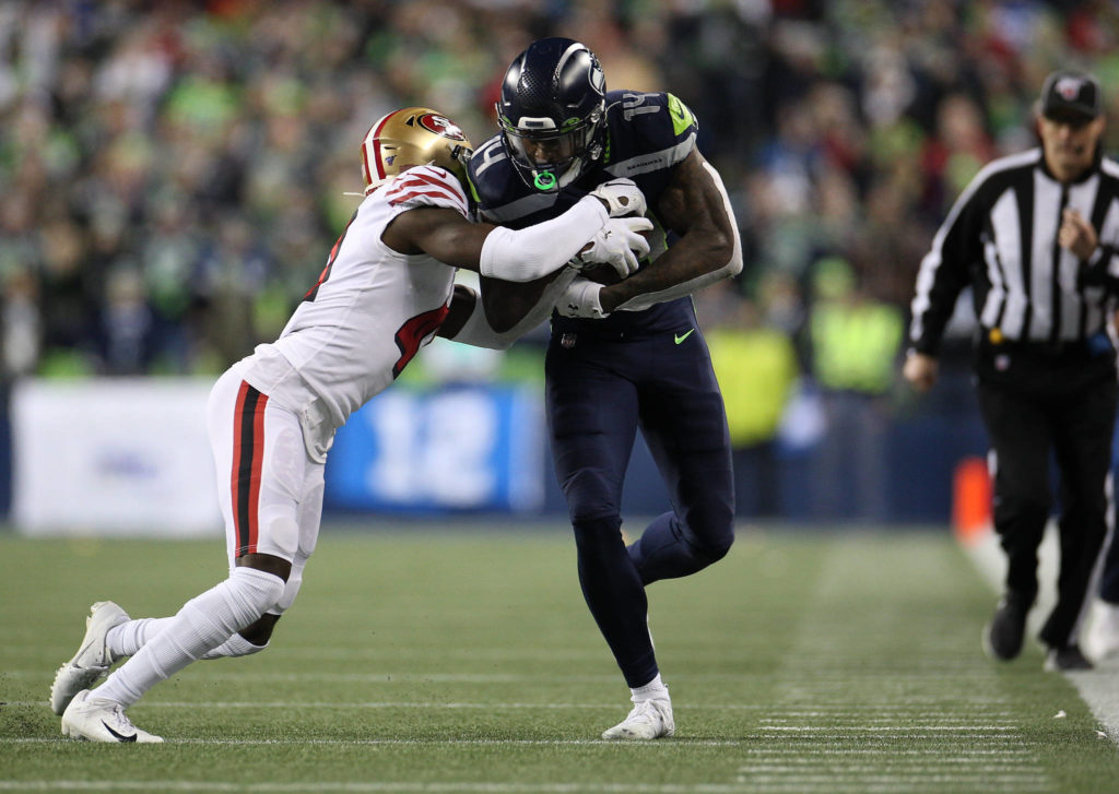 Seattle Seahawks DK Metcalf runs to the sidelines to stop the clock as the Seahawks lost to the San Francisco 49ers 26-21 at CenturyLink Field on Sunday, Dec. 29, 2019 in Seattle, Wash. (Andy Bronson / The Herald)
