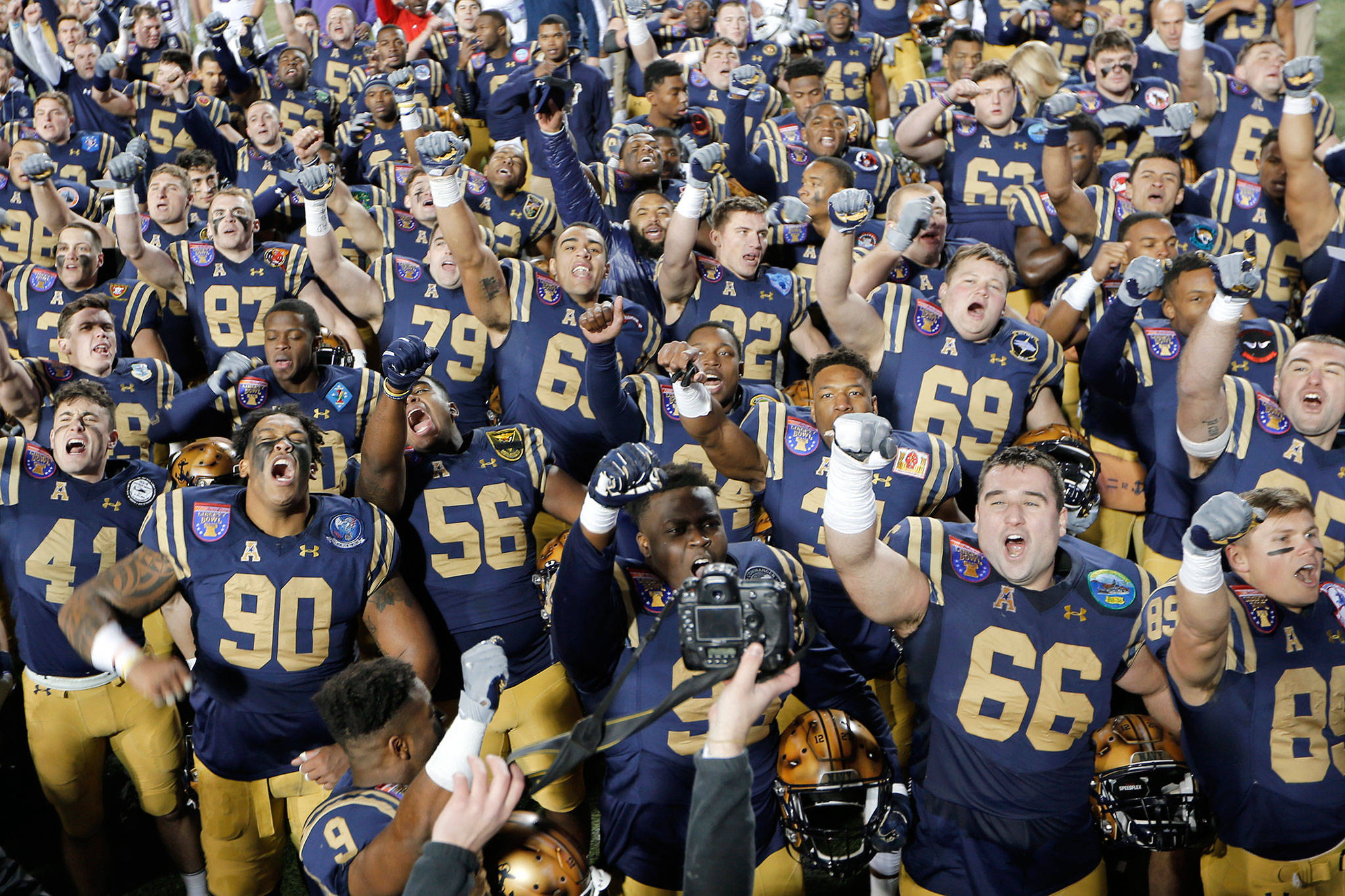 Navy players celebrate after beating Kansas State 20-17 in the Liberty Bowl on Tuesday in Memphis, Tenn. (AP Photo/Mark Humphrey)