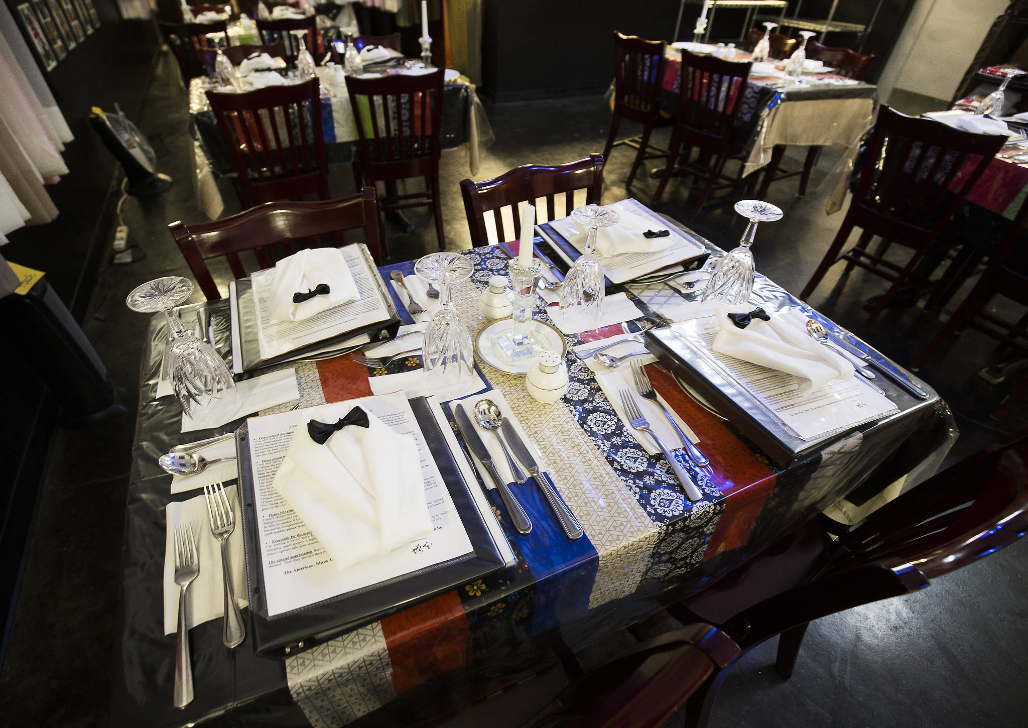 Formal settings for diners, with tux folded napkins at the Grouchy Chef, a reservations-only restaurant in Mukilteo with French cuisine and a chef who has the reputation of being grouchy. A four-course meal starts at $14 for braised chicken. (Andy Bronson / The Herald)