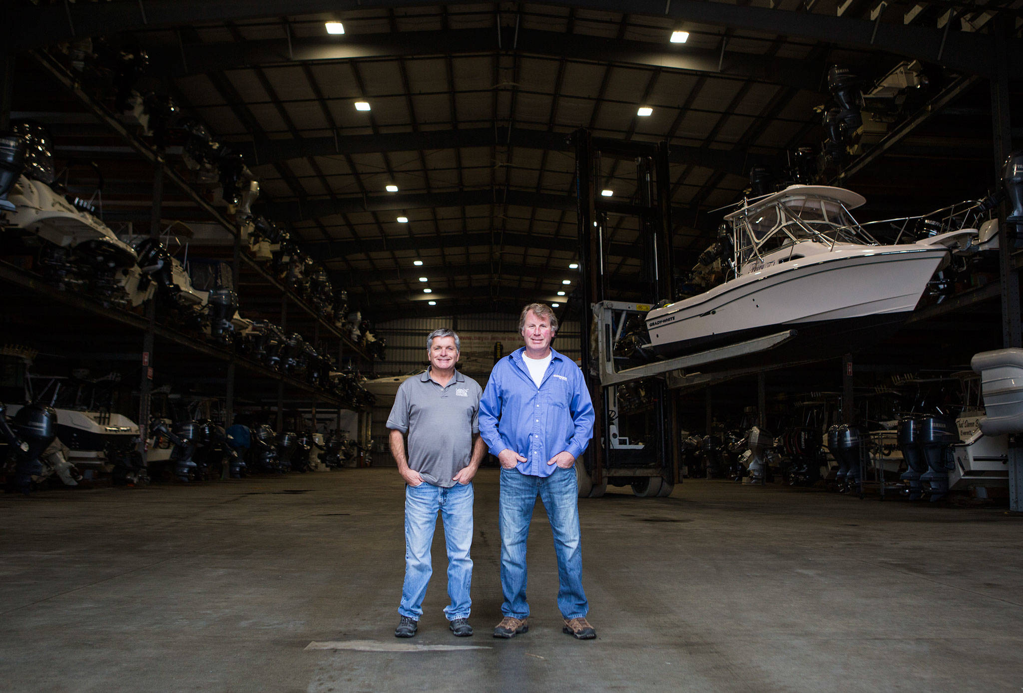 Bayside Marine co-owners Dan Hatch (left) and Jeff LaLone at their dry dock facility along the developing Everett waterfront. (Olivia Vanni / The Herald)