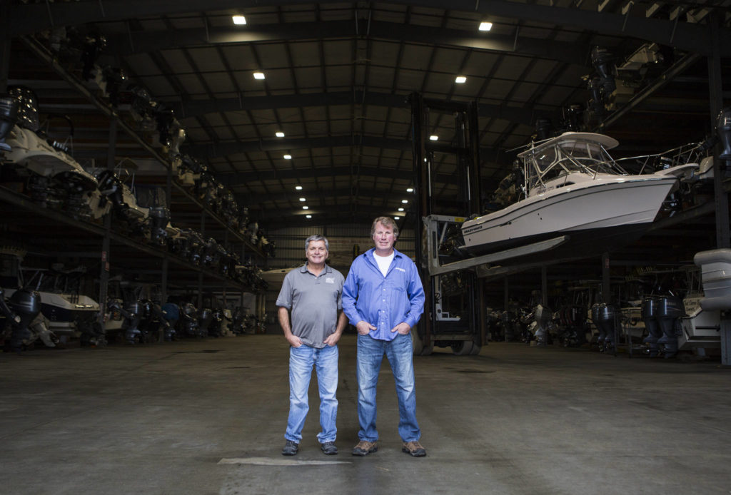Bayside Marine co-owners Dan Hatch (left) and Jeff LaLone at their dry dock facility along the developing Everett waterfront. (Olivia Vanni / The Herald)
