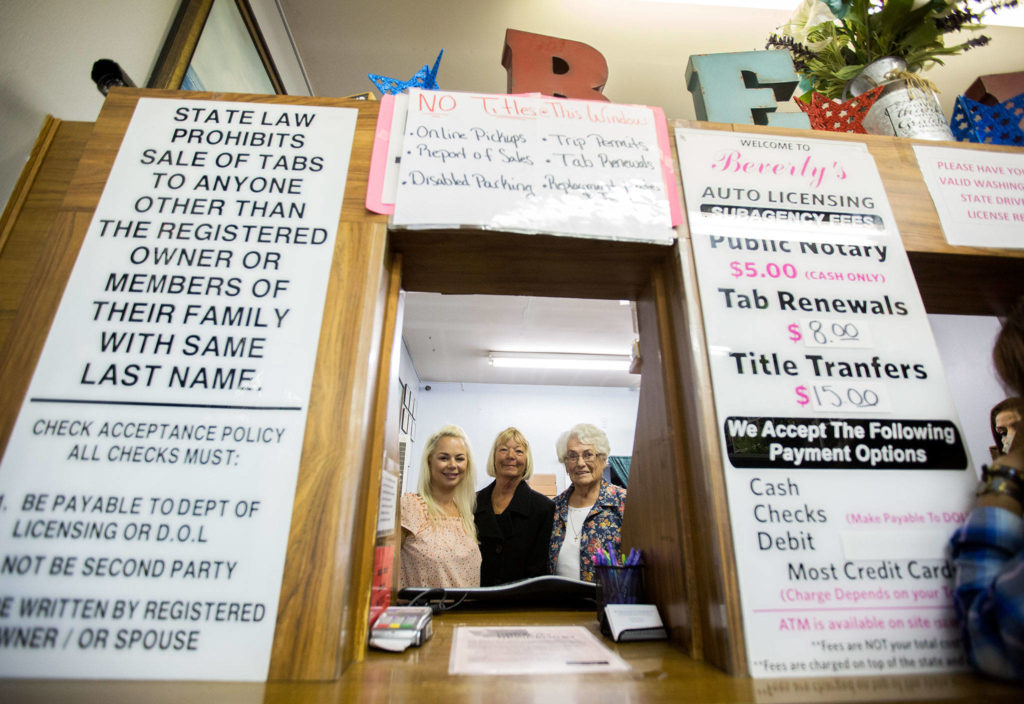 Sara Rice, Tammy Williams-Reinstra and Beverly Ren at Beverly’s Auto Licensing on Aug. 21 in Everett. (Olivia Vanni / The Herald)
