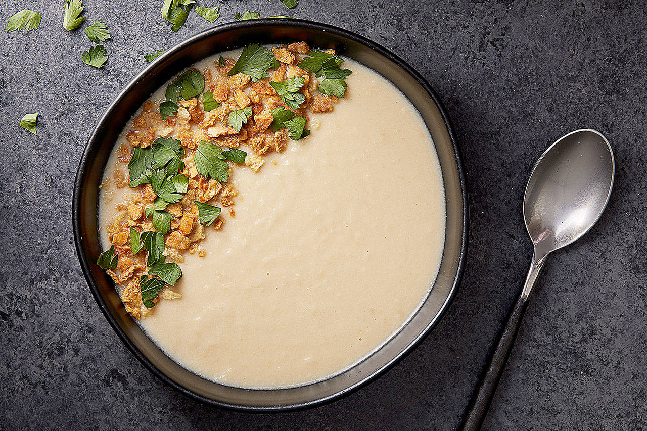 Creamy celery root soup has no cream. It’s creaminess comes from pureed celery root, white beans and tahini. (Photo by Tom McCorkle for The Washington Post)