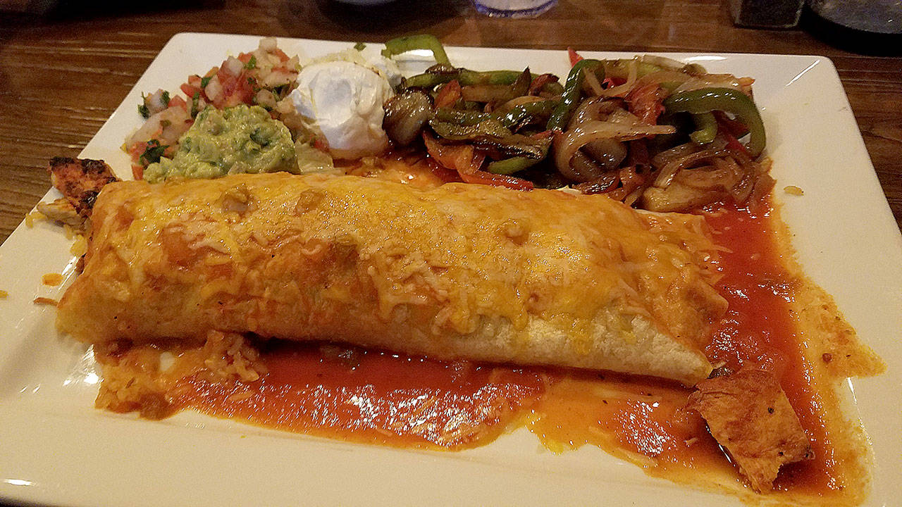 This fajita burrito at Santa Fe Mexican Grill & Cantina in Edmonds contains chicken and sauteed bell peppers and onions. (Sharon Salyer / The Herald)