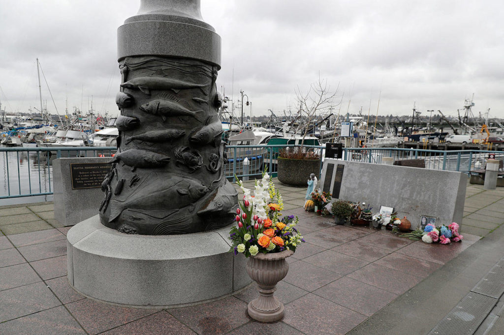 The Seattle Fishermen’s Memorial is shown Thursday in Seattle. Items left at the memorial Thursday included a ball cap with the name of the crab fishing boat Scandies Rose. (AP Photo/Ted S. Warren)
