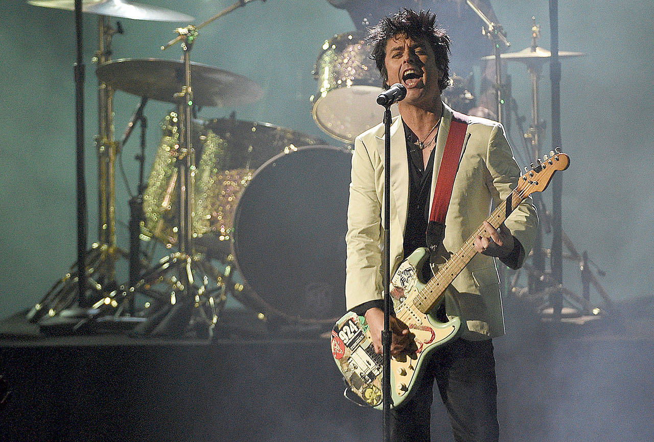 Billie Joe Armstrong, of Green Day, performs a medley at the American Music Awards on Nov. 24 at the Microsoft Theater in Los Angeles. Green Day’s 13th studio album is set to release Feb. 7. (Associated Press)