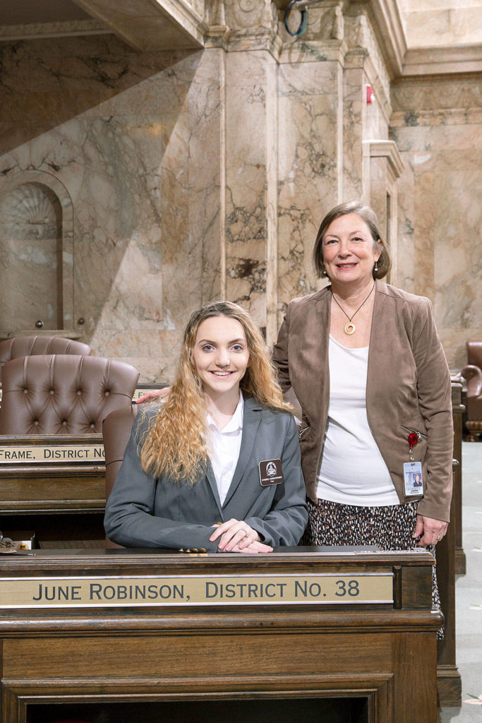 Syirria Christensen, a page, with State Rep. June Robinson. The Edmonds School District student from Marysville spent a week in January with the House of Representatives. (Washington State Legislative Support Services) 
