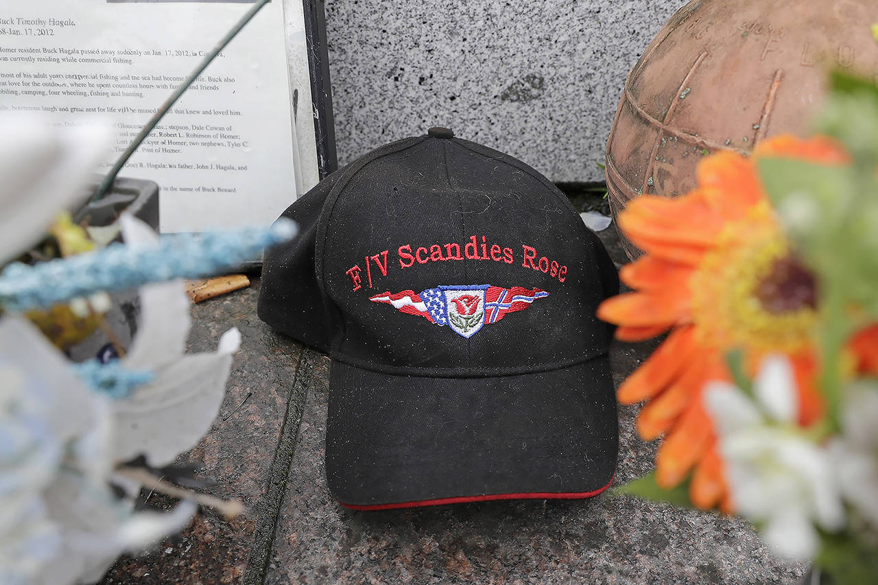 A ball cap with the name of the crab fishing boat Scandies Rose rests at the Seattle Fishermen’s Memorial on Thursday in Seattle. (AP Photo/Ted S. Warren)