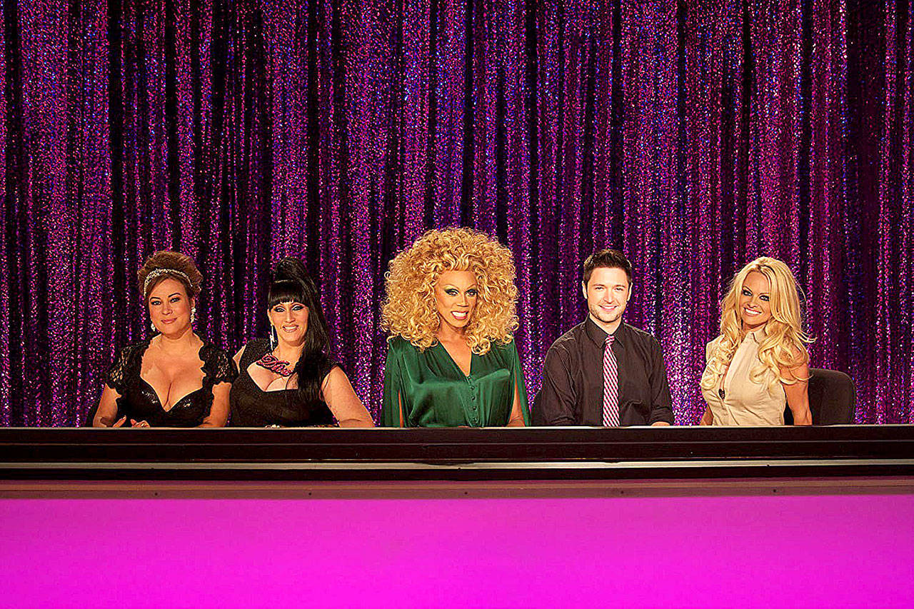RuPaul and fellow judges (From Right: Jennifer Tilly, Michelle Visage, RuPaul, Lucian Piane, and Pamela Anderson) dilerberate on RuPauls Drag Race. (World of Wonder Productions)