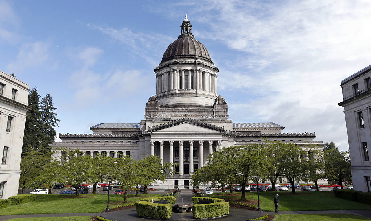 The Washington State Capitol, also known as the Legislative Building, is seen in Olympia. (AP Photo/Elaine Thompson, File)