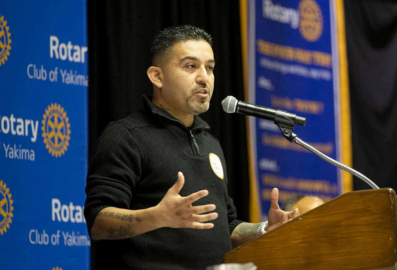 Chevy Cortez speaks to the Downtown Rotary Club about his time as a gang member and his organization The Love Project on Jan. 2 at the Yakima Convention Center in Yakima. (Evan Abell / Yakima Herald-Republic)