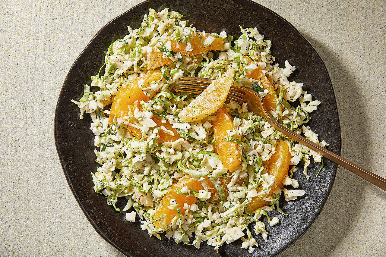 Brussels sprouts and cauliflower slaw with oranges is tossed with a buttermilk-poppy-seed dressing. (Photo by Tom McCorkle for The Washington Post)