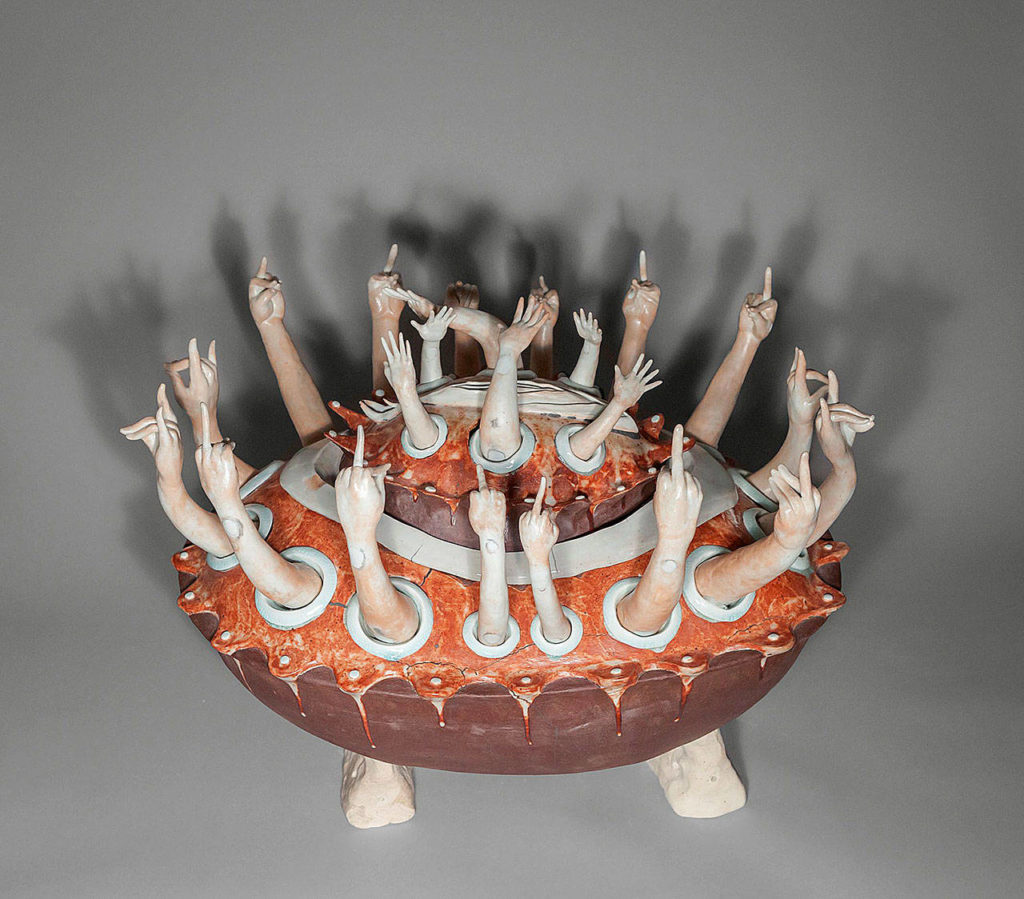 Hanako O’Leary’s sculpture, “Utsurobune, Hollow Ship,” was inspired by a Japanese folktale from the 19th century. The arms raised from the vessel have varying hand gestures with different meanings. (Sarah D. King)
