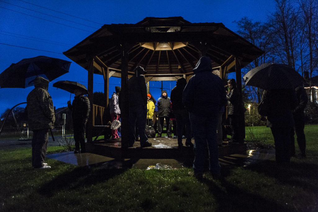 People stand around and wait for the union contract negotiation vigil to start at Northwest Everett Neighborhood Park across from Providence Region Medical Center Everett on Wednesday. (Olivia Vanni / The Herald).
