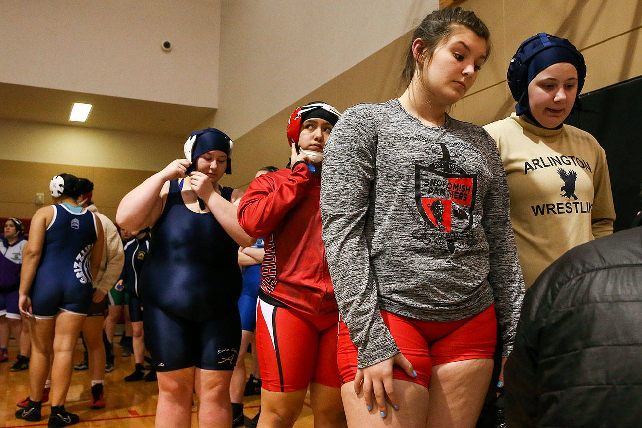 Scenes from a high school girls wrestling scramble