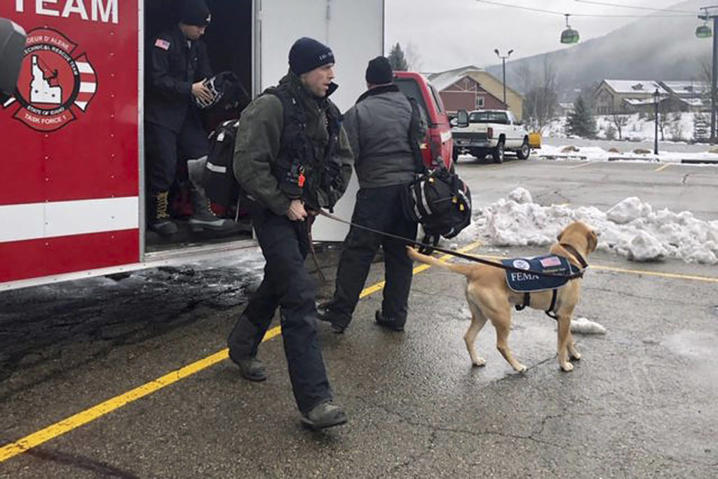 The Coeur d’Alene Fire Department K-9 Team responds to Silver Mountain for an avalanche in Kellogg, Idaho. (KHQ via AP)
