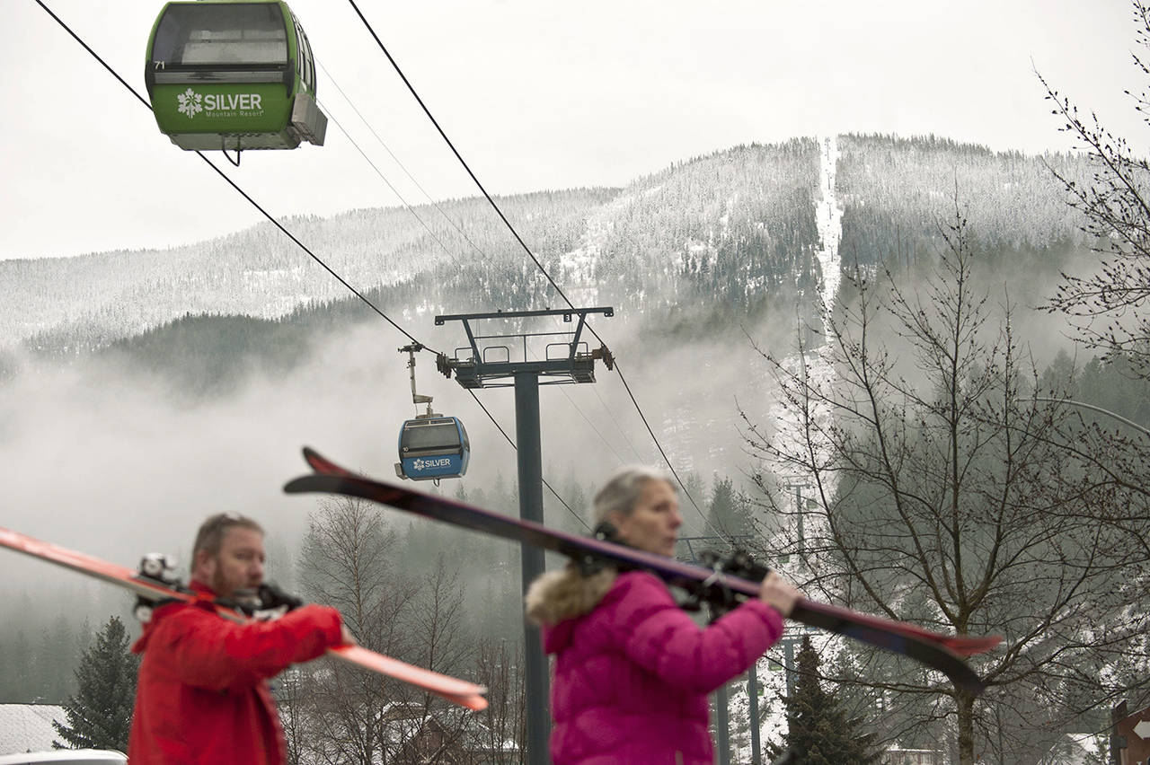 Skiers walk away from Silver Mountain after an avalanche after an avalanche killed multiple people and injured others on Tuesday in Kellogg, Idaho. (Kathy Plonka/The Spokesman-Review via AP)