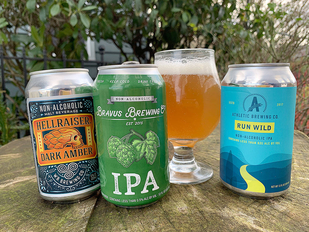 More non-alcoholic craft beers have hit the market recently, including beer, from left to right, Missouri’s Wellbeing Brewing, California’s Bravus Brewing Co. and Connecticut’s Athletic Brewing. (Aaron Swaney)
