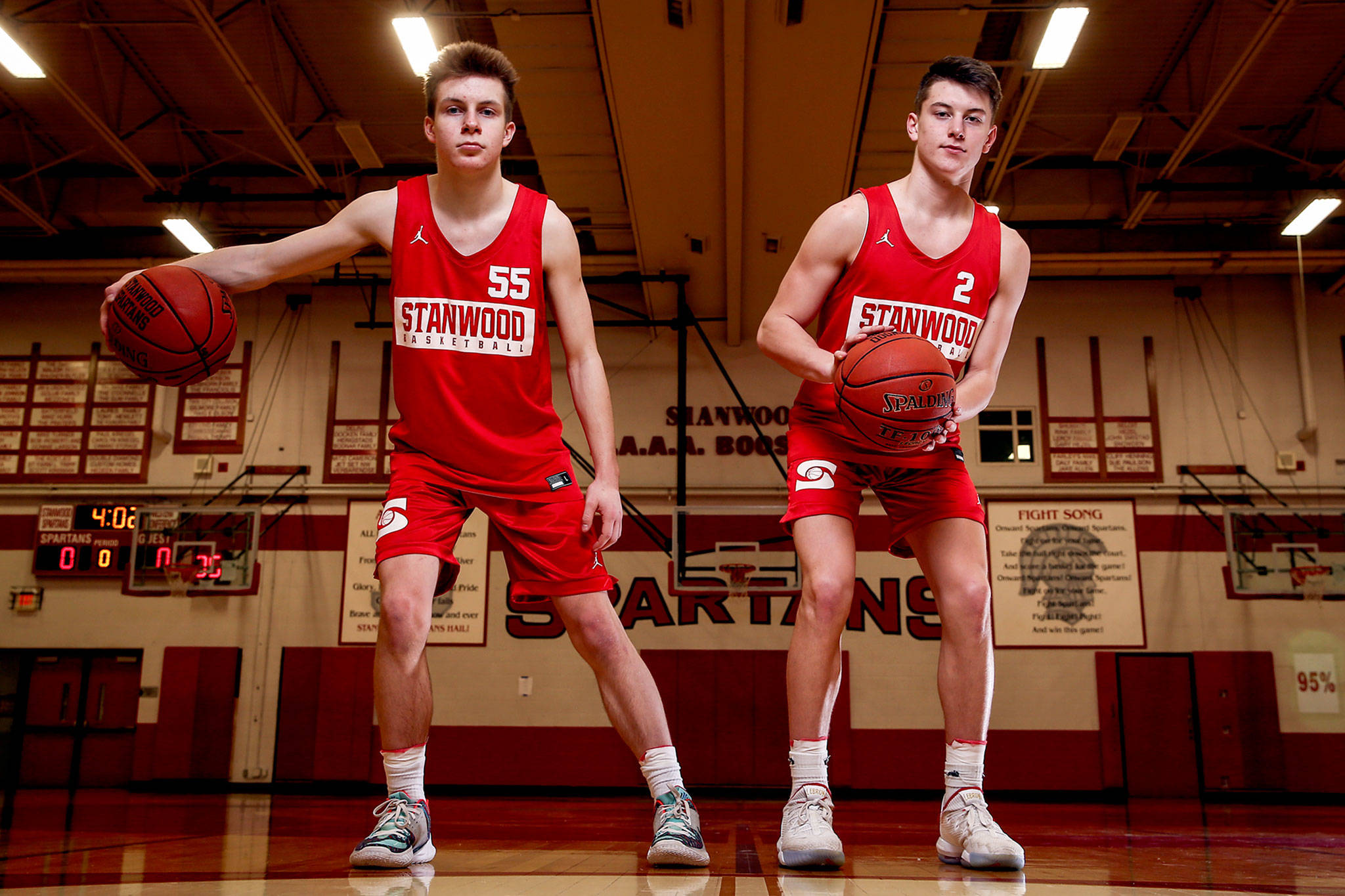 Stanwood junior guards Cort Roberson (left) and Jake Cleary have averaged a combined 40 points per game this season and both are the sons of former standout Snohomish County prep athletes. (Kevin Clark / The Herald)