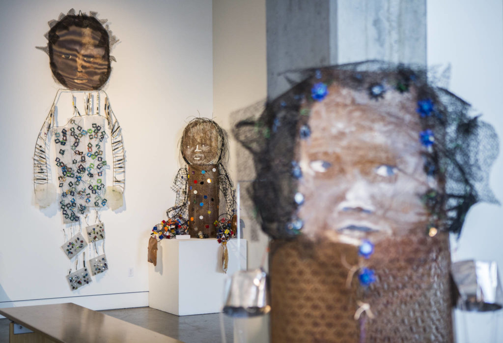 Marita Dingus’ “Guardian,” “Little Big Feet” and “Mother” sculptures are all made with recycled materials. (Olivia Vanni / The Herald)
