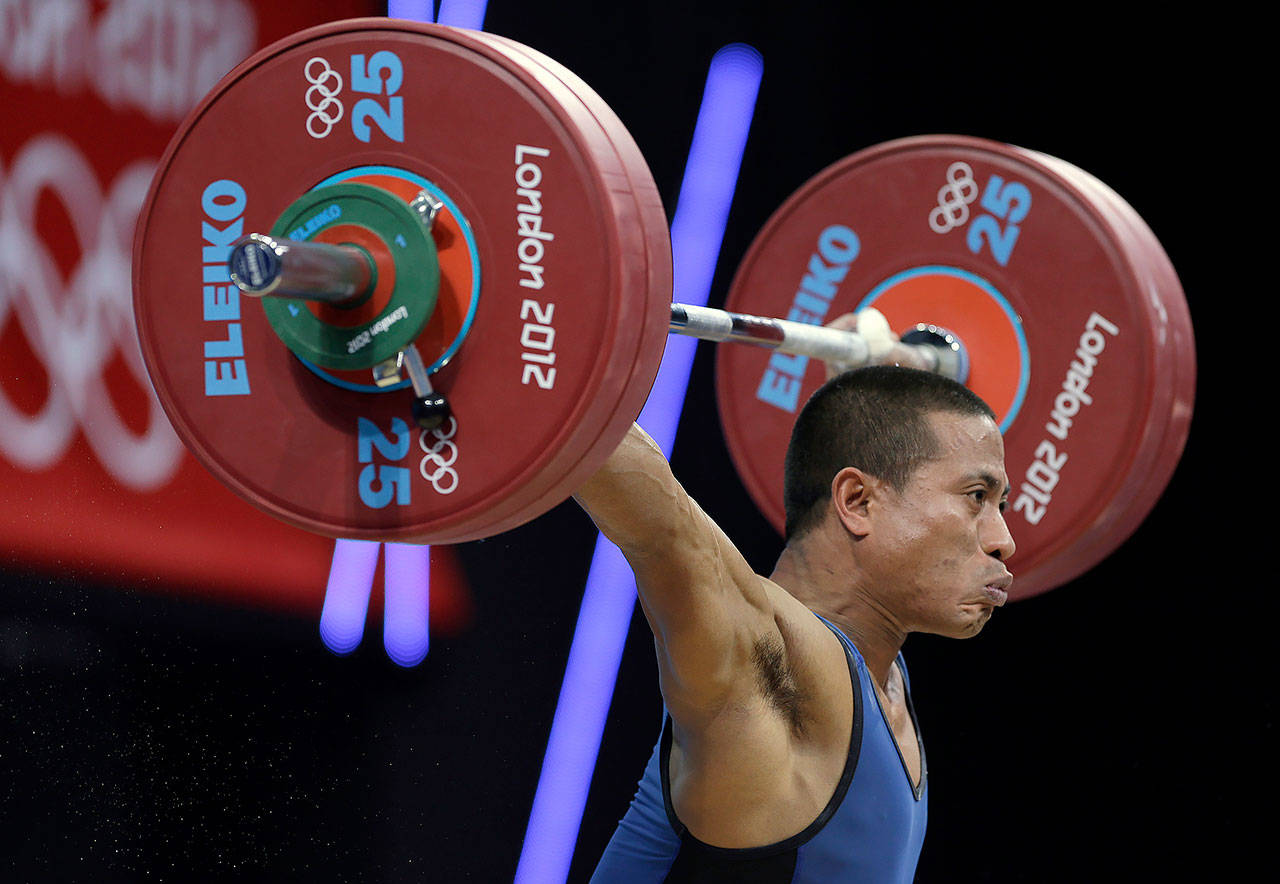 Manuel Minginfel of Micronesia during a weightlifting competition at the 2012 Summer Olympics in London. (AP Photo/Hassan Ammar, file)