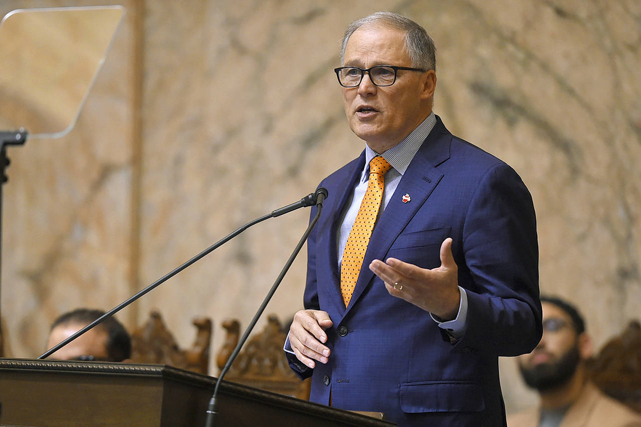 Washington Gov. Jay Inslee delivers his State of the State address during a joint session of the state Legislature in the House Chambers in Olympia on Tuesday. (Steve Bloom/The Olympian via AP)