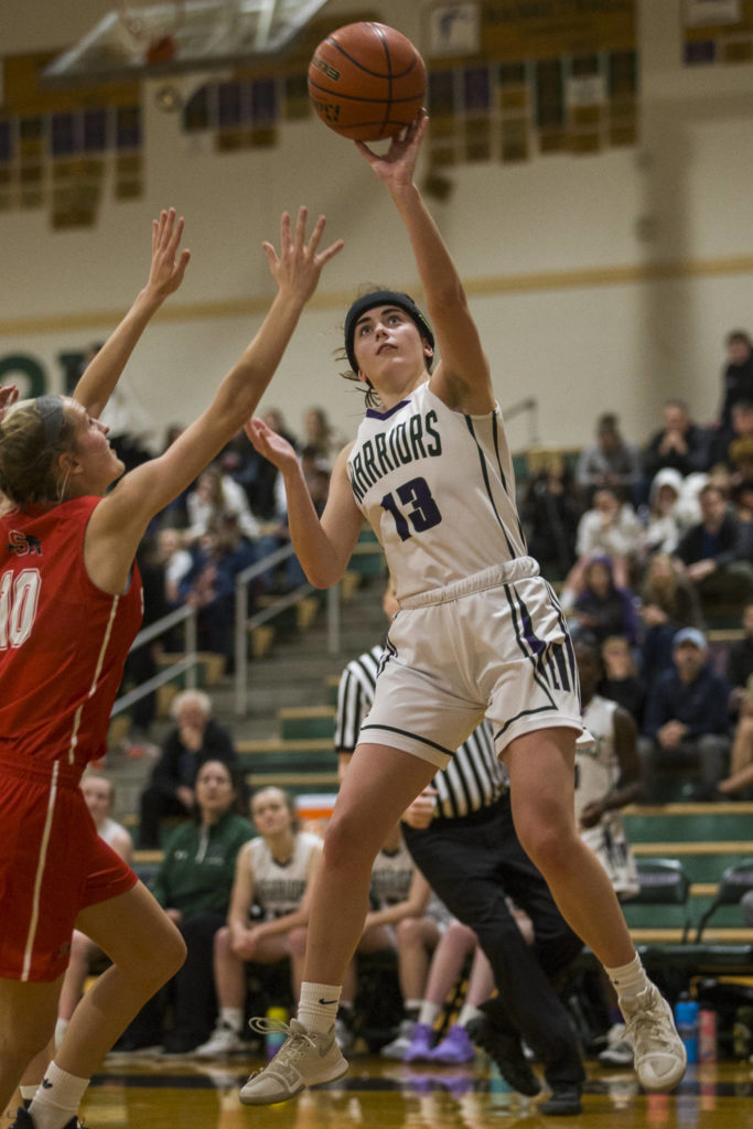 Edmonds-Woodway’s Jadyn Waram makes a jump shot during the Warriors’ 44-33 win over Snohomish in a Wesco 3A/2A game Friday in Edmonds. (Olivia Vanni / The Herald).
