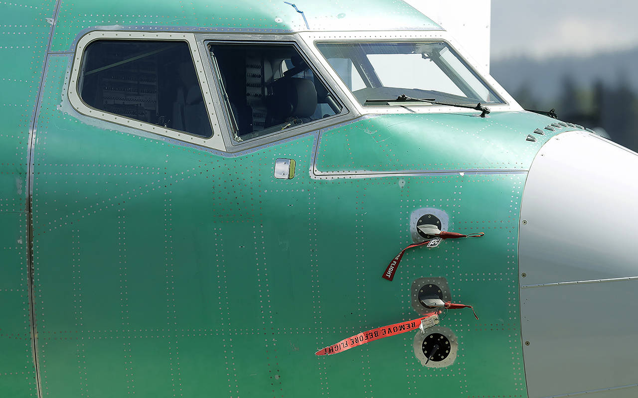 In this 2019 photo, caution flags are shown on flight sensors on a Boeing 737 Max 8 airplane being built at Boeing’s assembly facility in Renton. (AP Photo/Ted S. Warren, file)