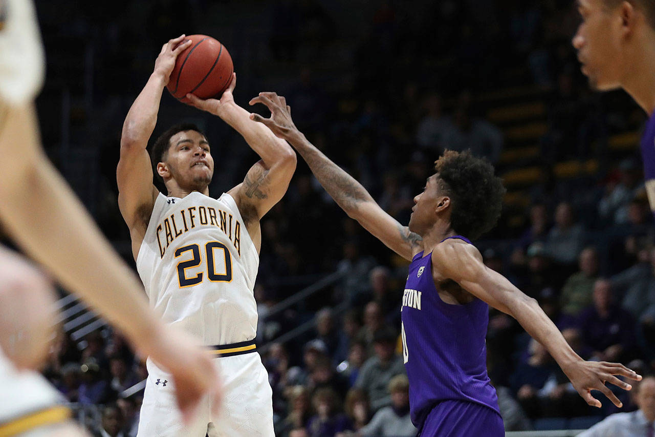 California guard Matt Bradley (20) hits the winning basket in overtime against Washington forward Jaden McDaniels (0) during a game in Berkeley, Calif., Saturday, Jan. 11, 2020. (AP Photo/Jed Jacobsohn)