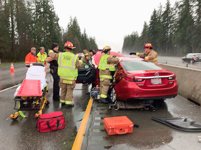 Two people were hospitalized Sunday afternoon after a crash on northbound I-5 north of 172nd Street N.E. near Smokey Point. One patient had life-threatening injuries. (Marysville Fire District)