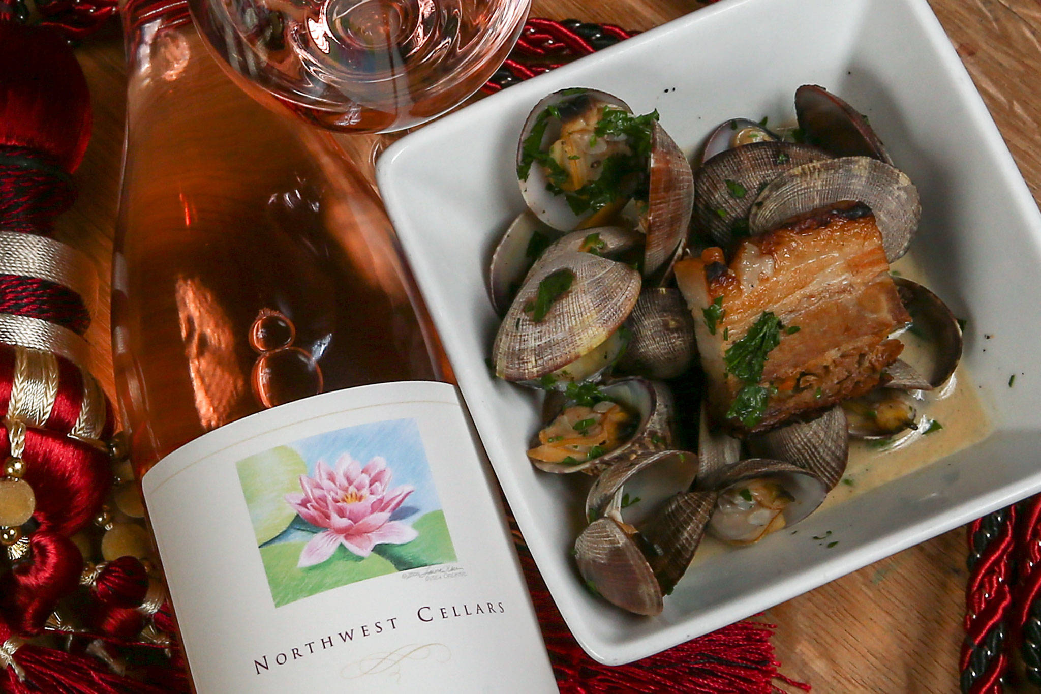 Chef Greg Claus paired Northwest Cellars’ Leggiero rose with Manila clams and braised pork belly. (Kevin Clark / The Herald)