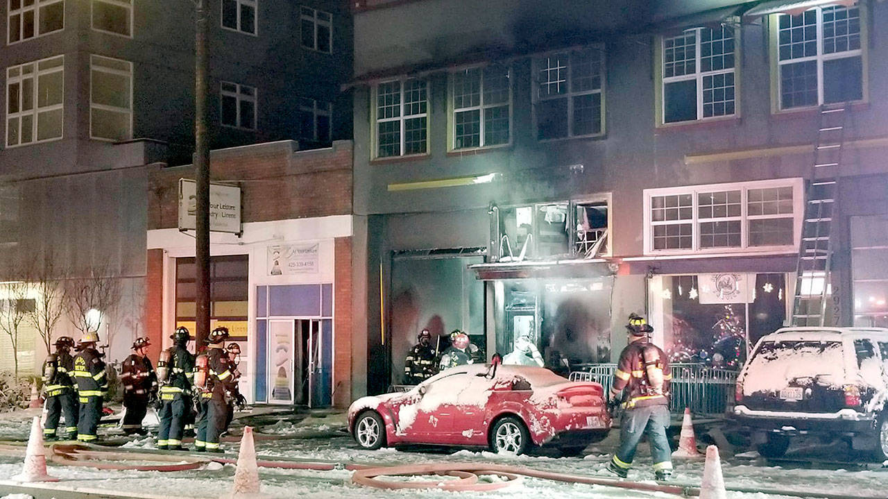 Firefighters respond to Mike’s Performance Automotive in downtown Everett early Monday morning. (Everett Fire Department)