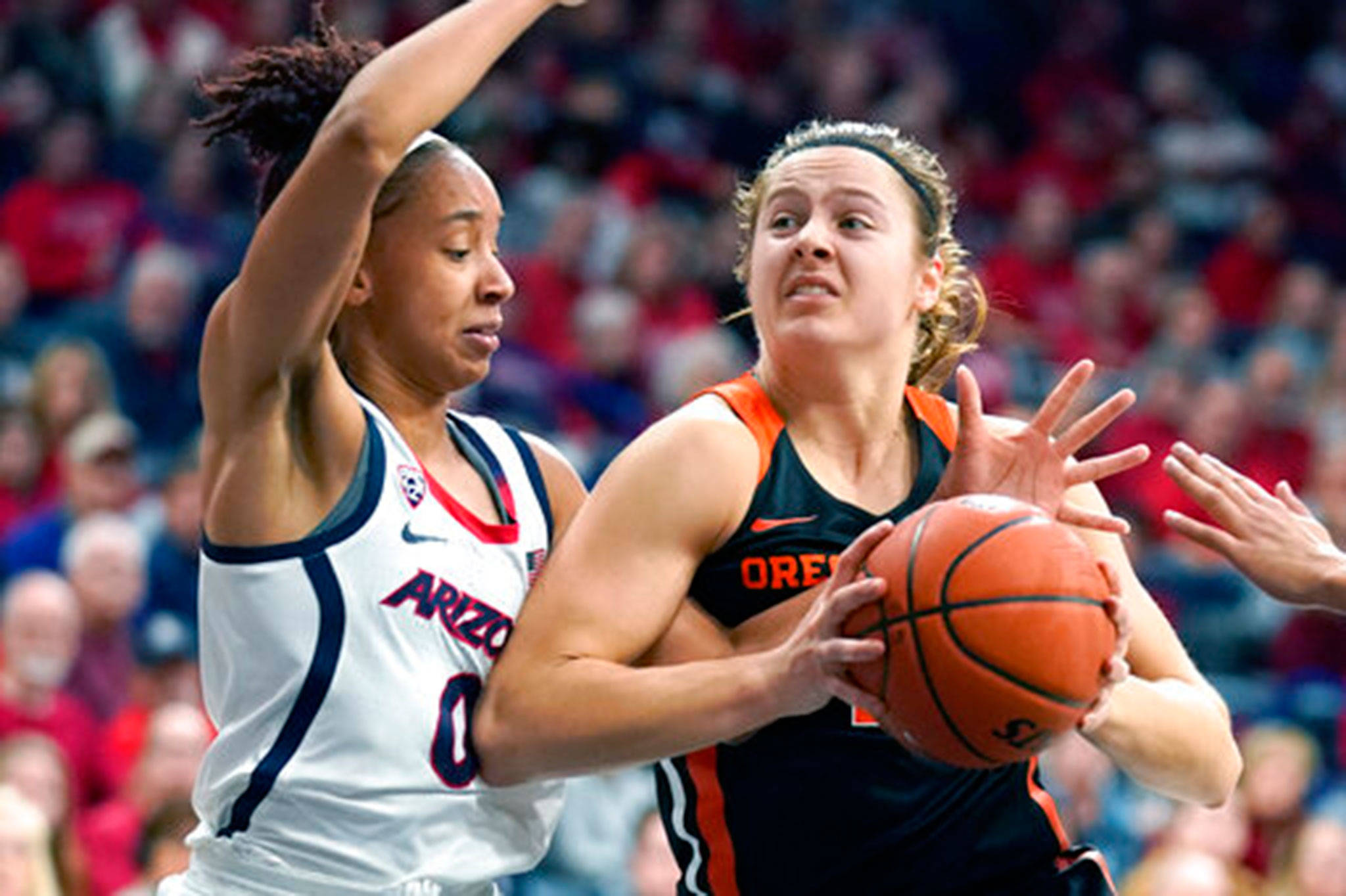 Oregon State guard Mikayla Pivec (right), a Lynnwood High School alum, goes up for a shot during a game against Arizona on Jan. 10, 2020, in Tucson, Ariz. (AP Photo/Rick Scuteri)