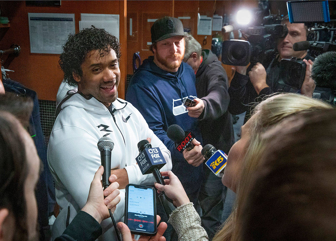Ellen M. Banner/The Seattle Times via AP                                Seattle’s Russell Wilson speaks to the media as the Seahawks clean out their lockers at the team’s headquarters Monday in Renton.