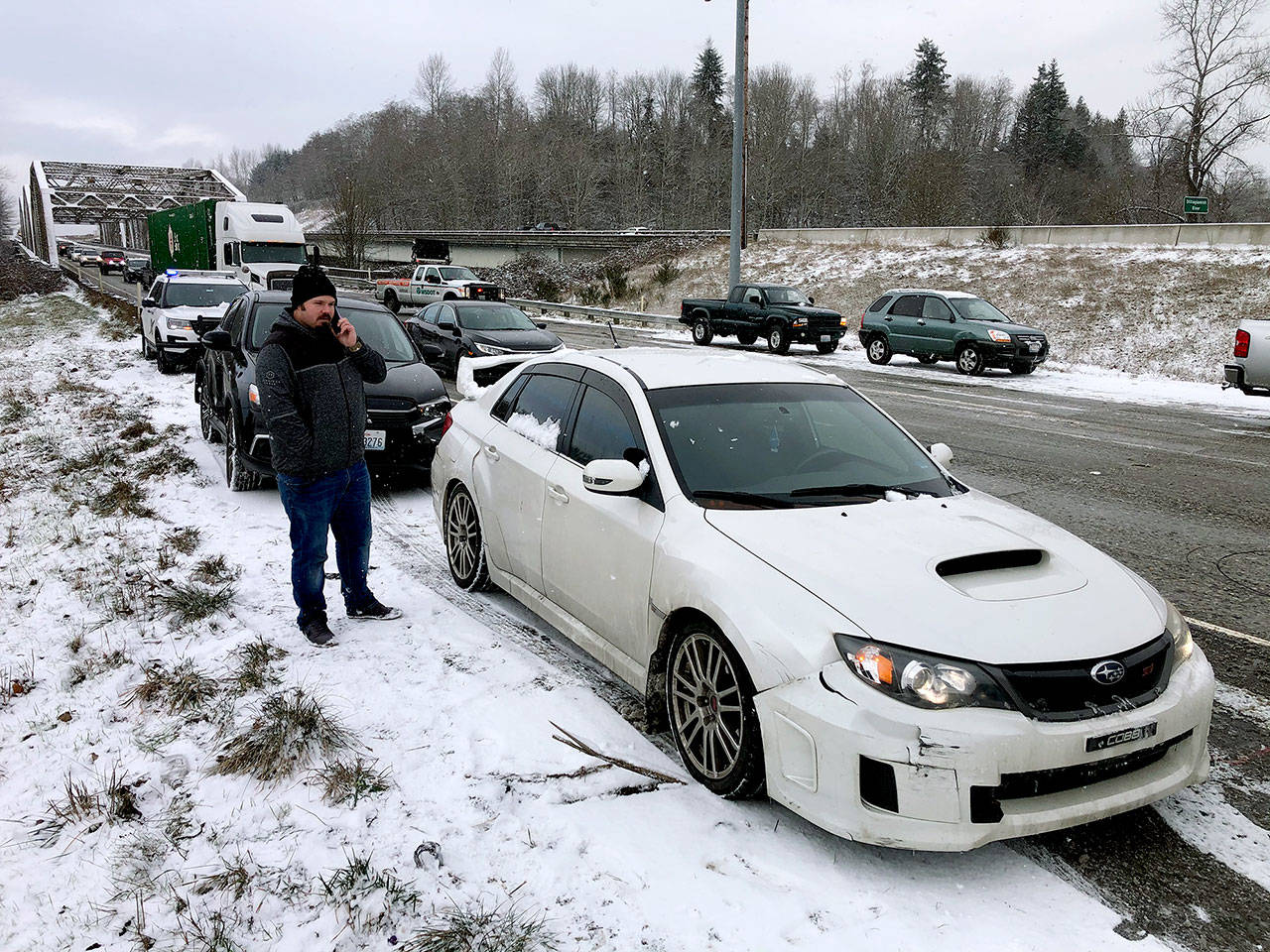 Ryan Krahmer’s Subaru was one of many cars involved in accidents Tuesday. This is on southbound I-5 near the Stillaguamish River bridge. (Andy Bronson / The Herald)
