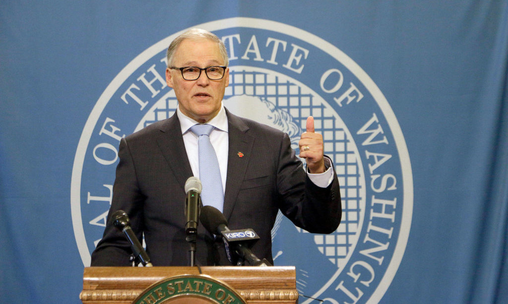 Washington Gov. Jay Inslee talks to the media after a state Supreme Court ruling that reinstated a severely limited version of his plan to cap carbon pollution in the state. (AP Photo/Rachel La Corte) 
