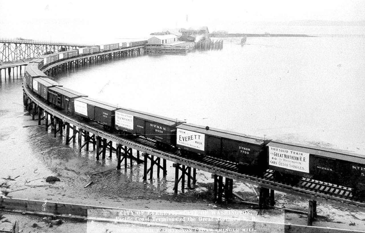 This train with 40 boxcars of Neff and Mish shingles was the first to leave Everett for eastern markets in 1893. The mill sat halfway out on the north side of the 14th Street Dock, which extended about 2,000 feet over the Gardner Bay tidal flats. (Photo courtesy of Everett Public Library)