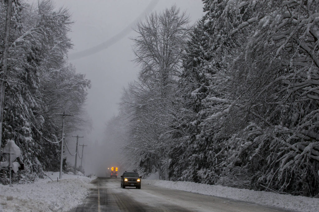 A utility vehicle warns drivers to slow down due to works along US 2 near Baring on Wednesday. (Olivia Vanni / The Herald)
