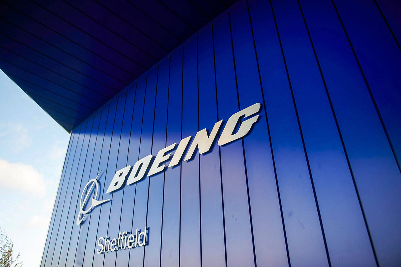 The Boeing logo hangs from an entrance to its factory in Sheffield, England, in 2018. (Matthew Lloyd/Bloomberg, file)