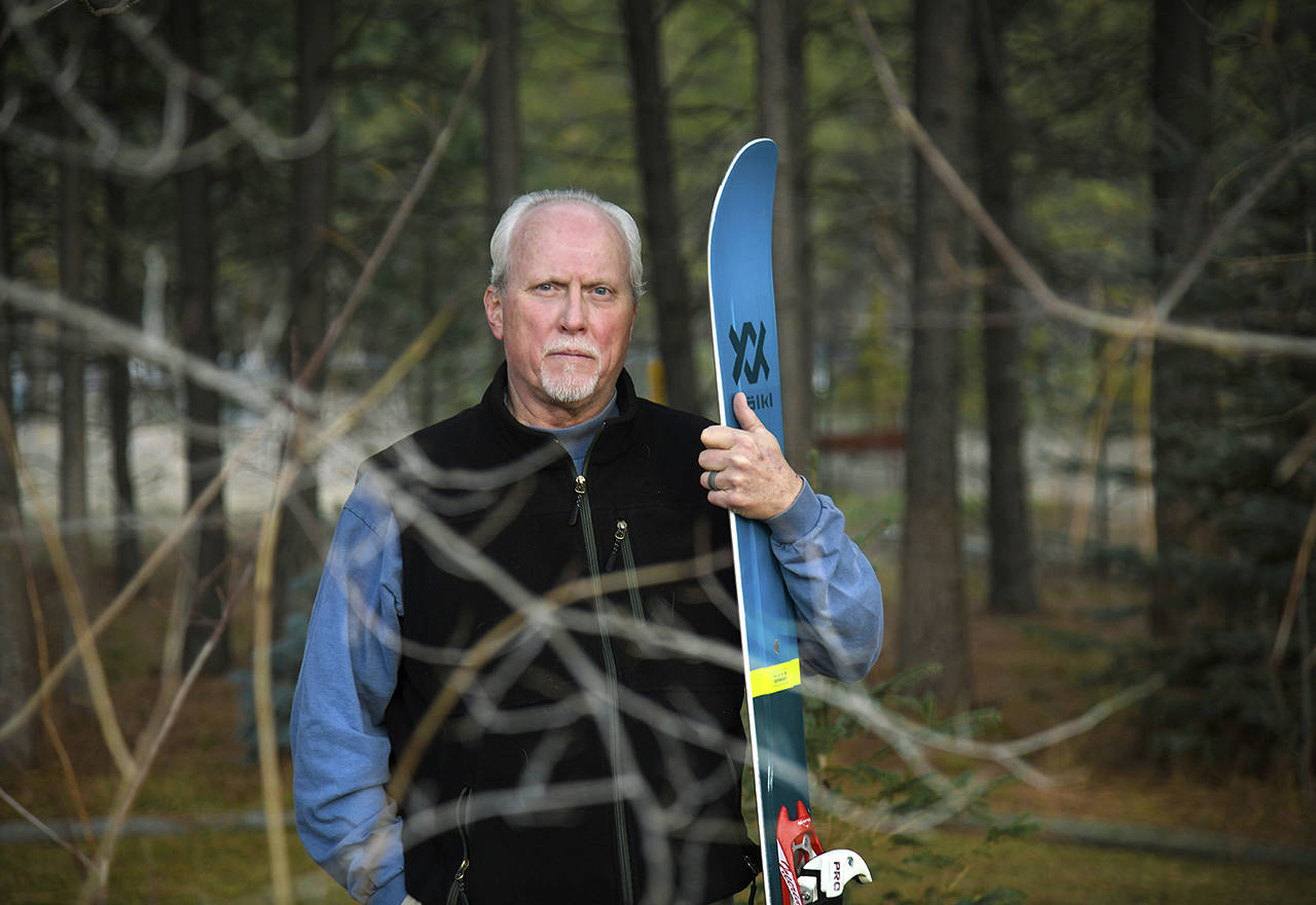 In this Jan. 8 photo, Bill Fuzak poses at his home in Colbert, Washington. Buried under about 10 feet of snow after an avalanche this week at an Idaho ski resort, Fuzak made peace with his predicament and prepared for death. He became one of four survivors extricated from the Jan. 7 avalanche at the Silver Mountain Resort near Kellogg, Idaho. (Dan Pelle/The Spokesman-Review via AP, file)