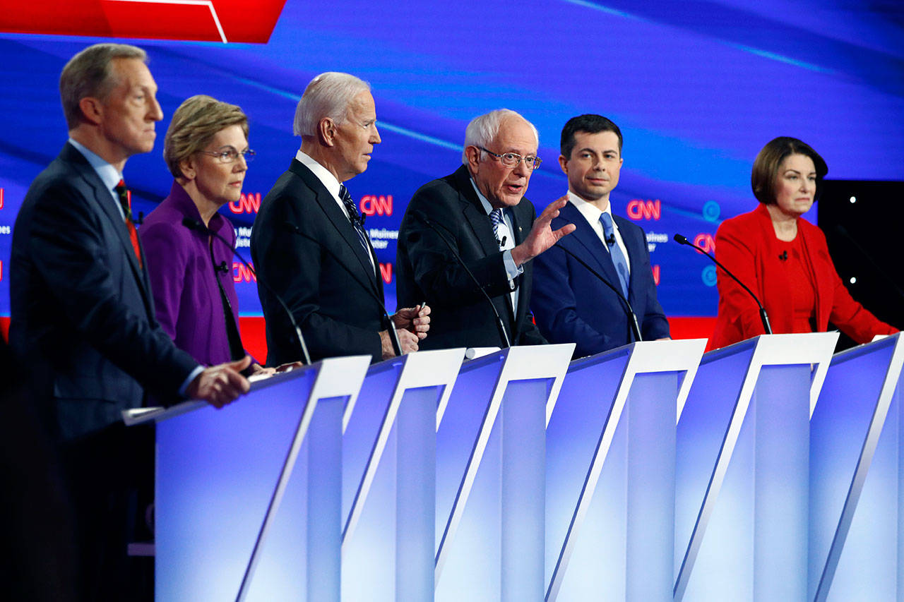 Democratic presidential candidate Sen. Bernie Sanders, I-Vt., (center) speaks as fellow candidates (from left) businessman Tom Steyer, Sen. Elizabeth Warren, D-Mass., former Vice President Joe Biden, former South Bend, Ind., Mayor Pete Buttigieg and Sen. Amy Klobuchar, D-Minn., listen, Jan. 14, during a Democratic presidential primary debate hosted by CNN and the Des Moines Register in Des Moines, Iowa. (Patrick Semansky / Associated Press)