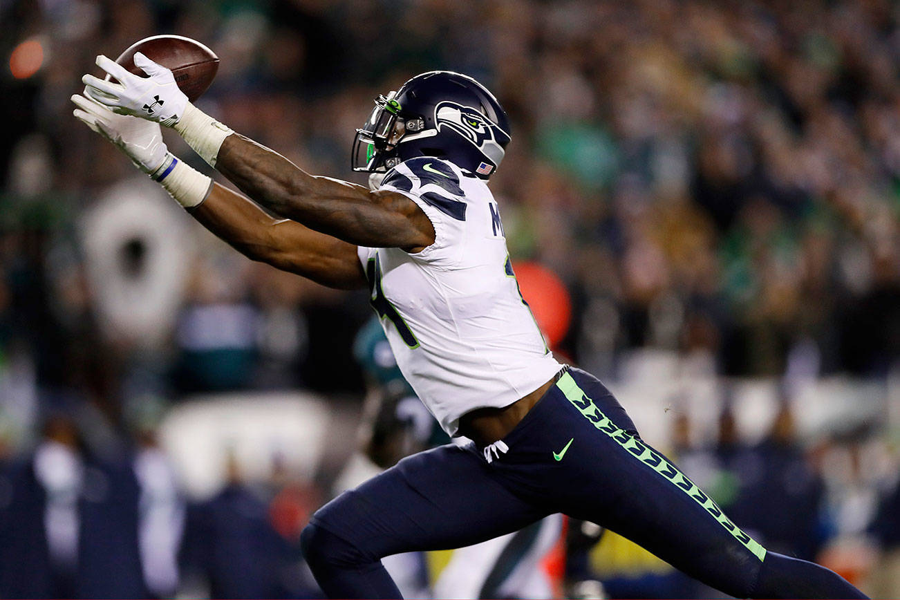 D.K. Metcalf and the Seattle Seahawks received a B grade from the majority of poll voters for the 2019 season. (AP Photo/Julio Cortez)