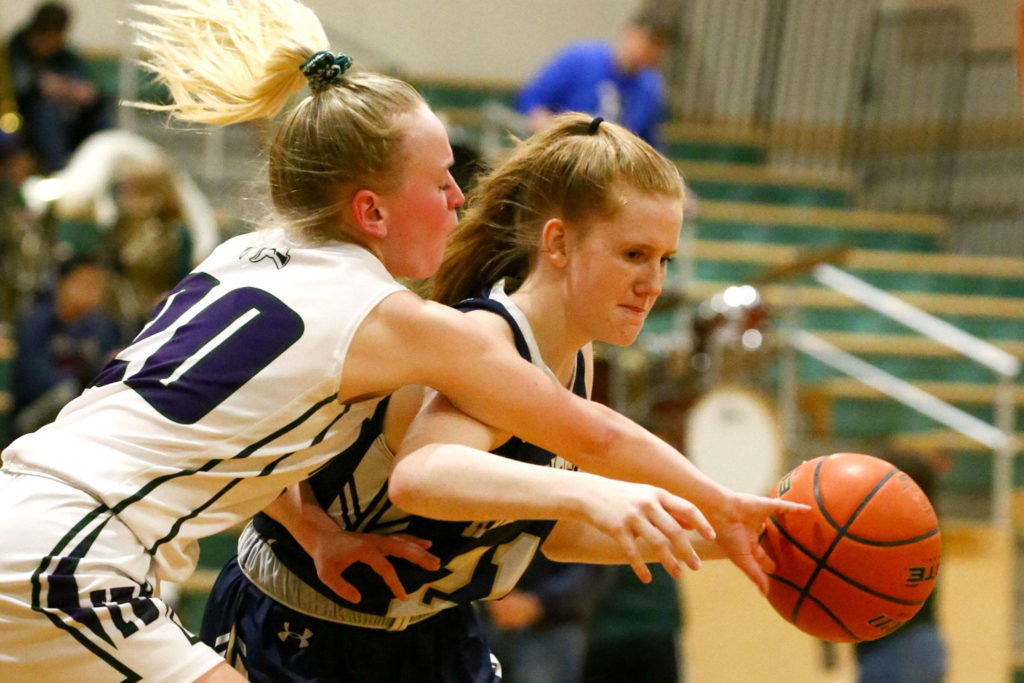 Arlington defeated Edmonds-Woodway 60-34 Thursday evening at Edmonds-Woodway High School on January 16, 2020. (Kevin Clark / The Herald)
