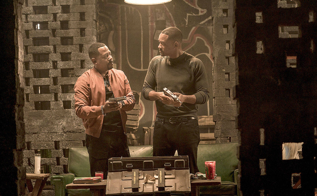 Martin Lawrence (left) and Will Smith exchange bromance banter in between cartoon-like gun battles in “Bad Boys for Life.” (Columbia Pictures)