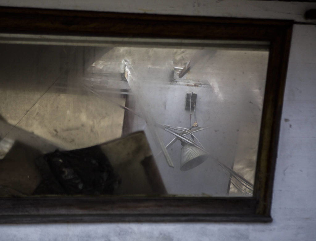 Light filters through a hole in the roof of the Argosy on Friday in Tulalip. (Olivia Vanni / The Herald)
