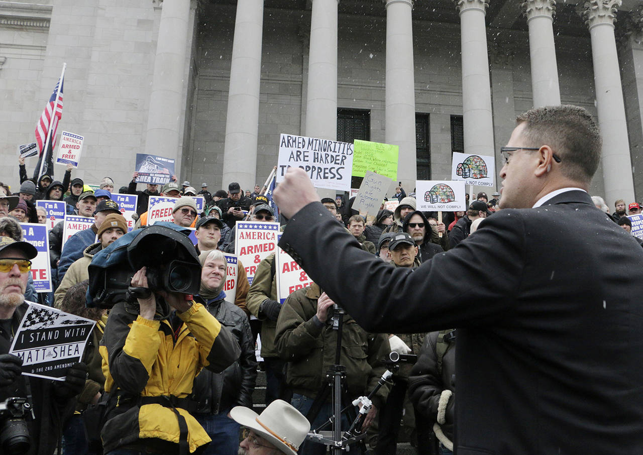 Republican Rep. Matt Shea speaks at a gun-rights rally, where many gathered in support of the embattled lawmaker, in Olympia on Friday. (AP Photo/Rachel La Corte)