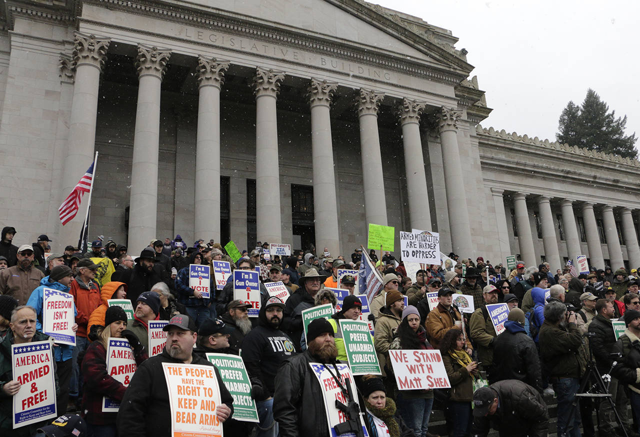 Gun-rights supporters rally on the steps of the Washington Capitol in Olympia on Jan. 17. (AP Photo/Rachel La Corte)