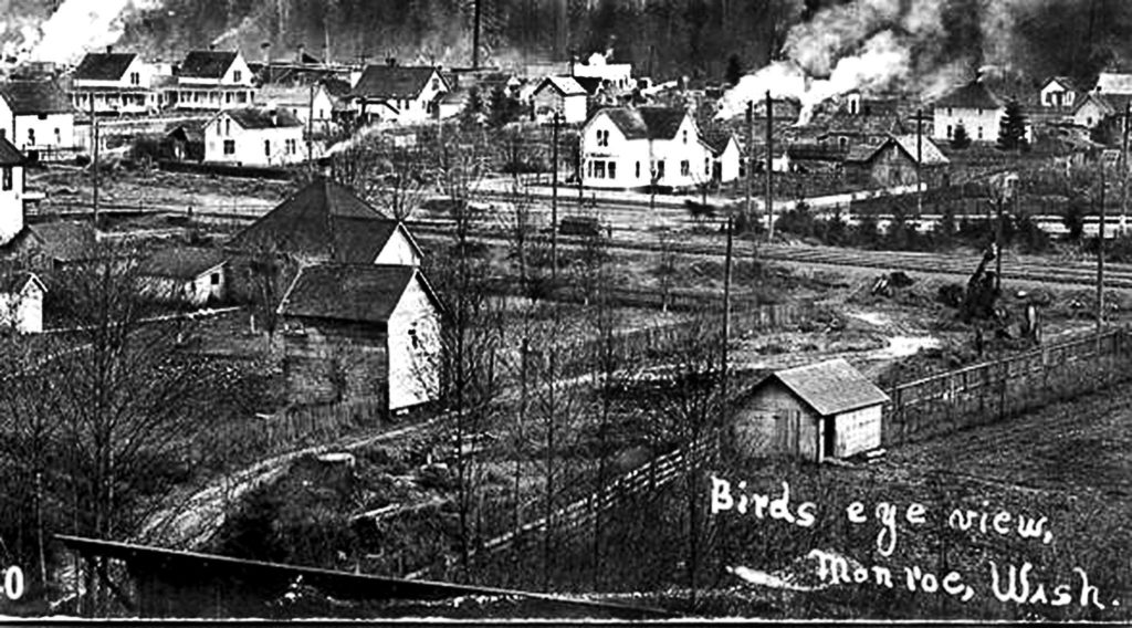 This 1906 image, from the book “Early Monroe,” is a view of the eastern part of Monroe. In the upper left corner are two 1903 houses, the original homes of Siralpha Buck and his son, A.H. Buck. The family lived here, creating and running the Buck Shingle Mill. (Monroe Historical Society)
