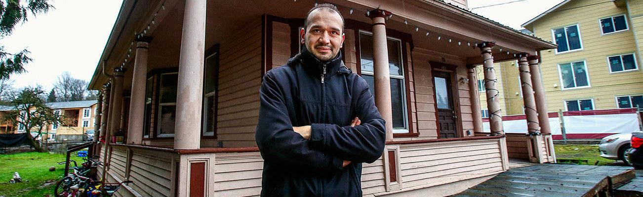 Emanuel Popa owns two adjacent 1903 houses on South Ann Street. The original Monroe homes of the family that ran Buck’s Shingle Mill, they may be demolished to make way for apartments. Popa is willing to give them away to anyone who wants to pay to move them. (Dan Bates / The Herald)